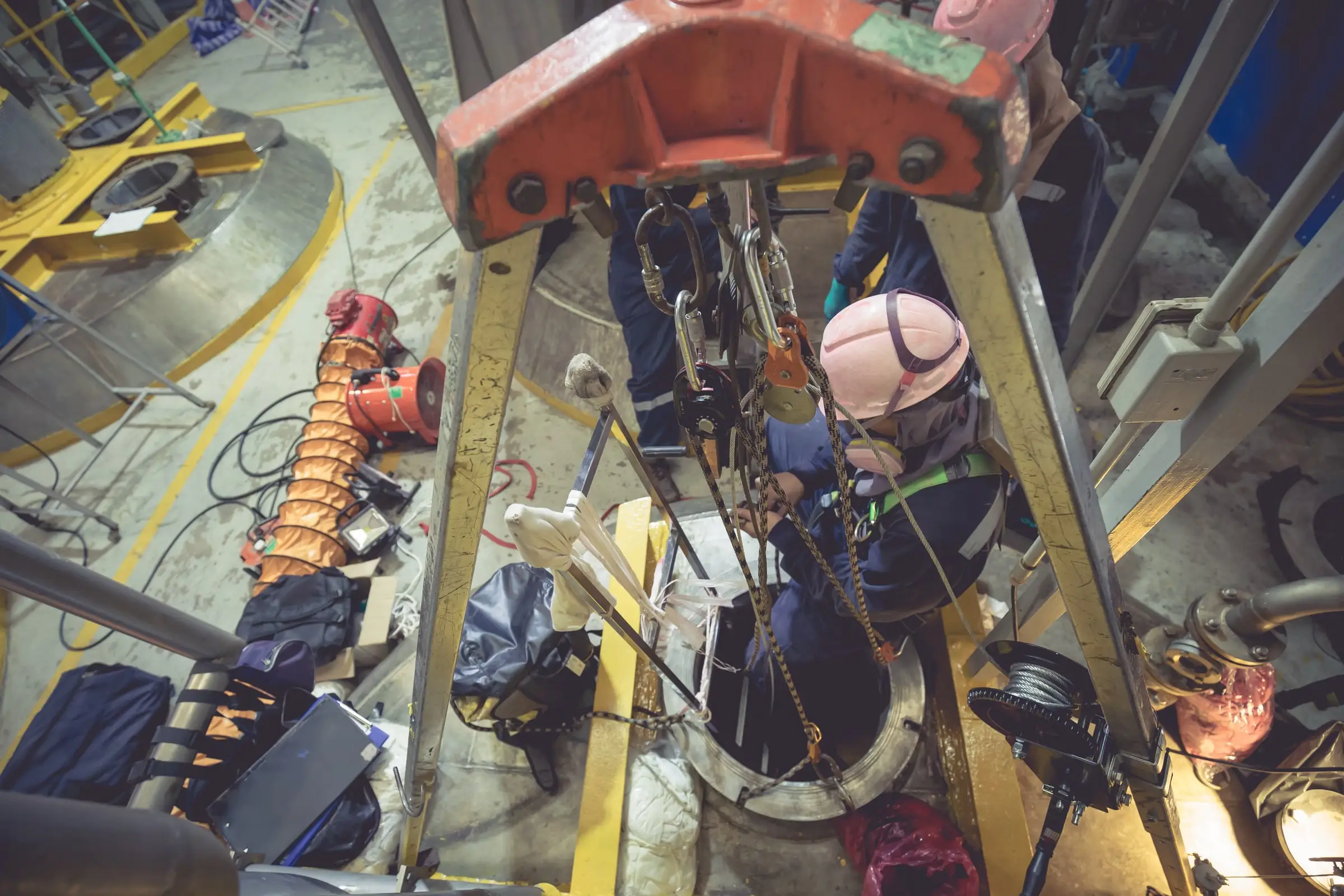 Technicians working inside a vessel