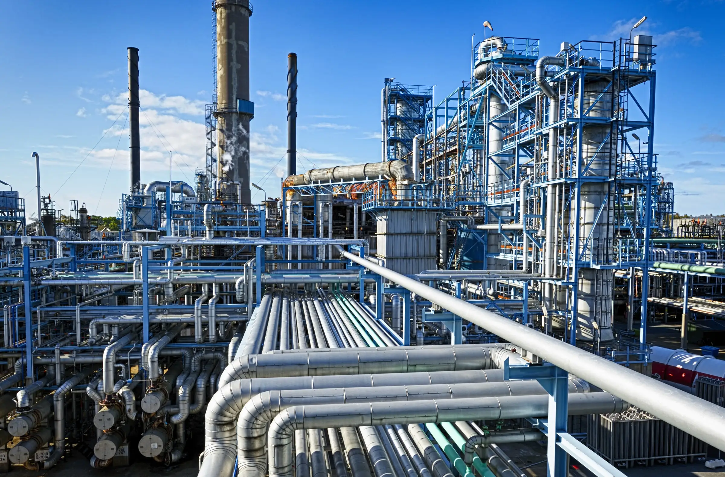 Process plant against a cloudy sky